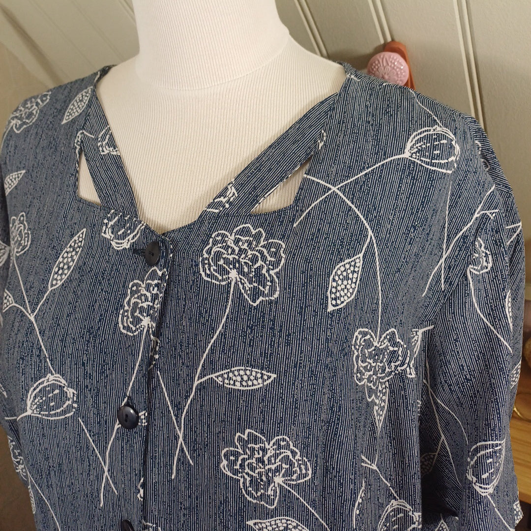 Robe grise à motifs blancs, taille 54